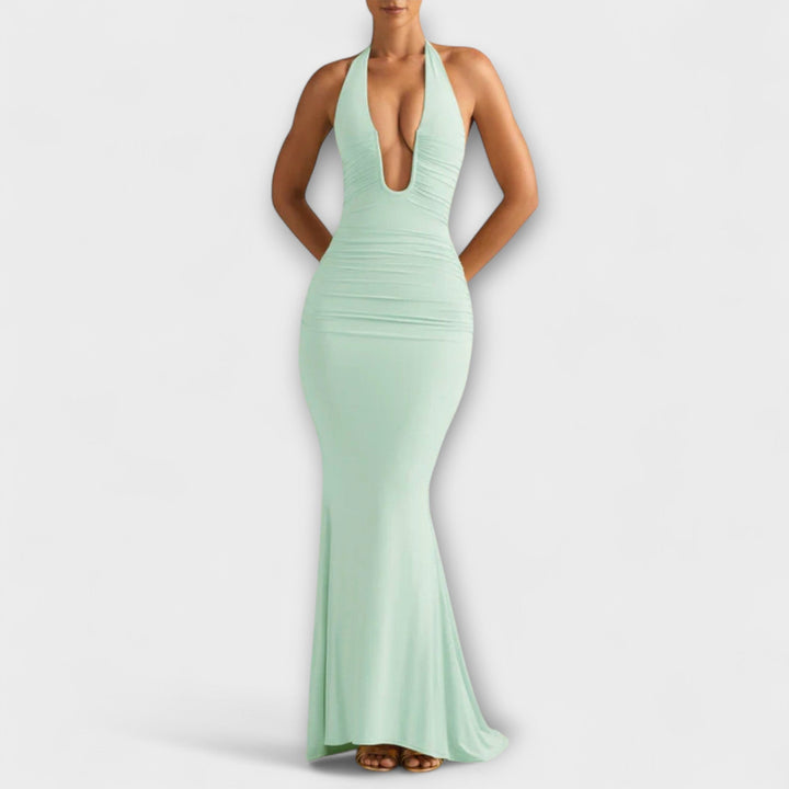 Elegantiška vakarėlių suknelė su atvira nugara ir įspūdinga iškirpte